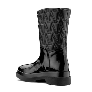 VALENTINO Flatform ankle boots in black faux leather matelassé
